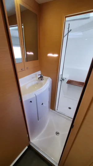 Blue Mind Yacht Photos Pics Bathroom interior of 2018 Lagoon 380 S2 yacht with shower and sink.