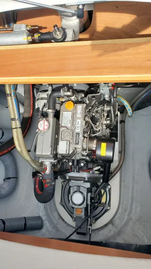 Blue Mind Yacht Photos Pics Engine compartment of a 2018 Lagoon 380 S2 catamaran, showcasing mechanical components.
