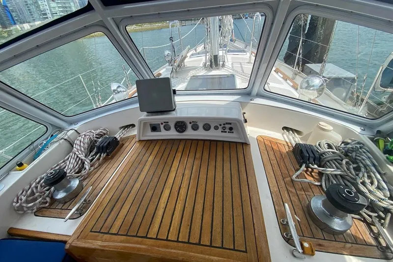 Ganache II Yacht Photos Pics Cockpit of 1985 Liberty 458 sailboat with wooden deck and navigation equipment.
