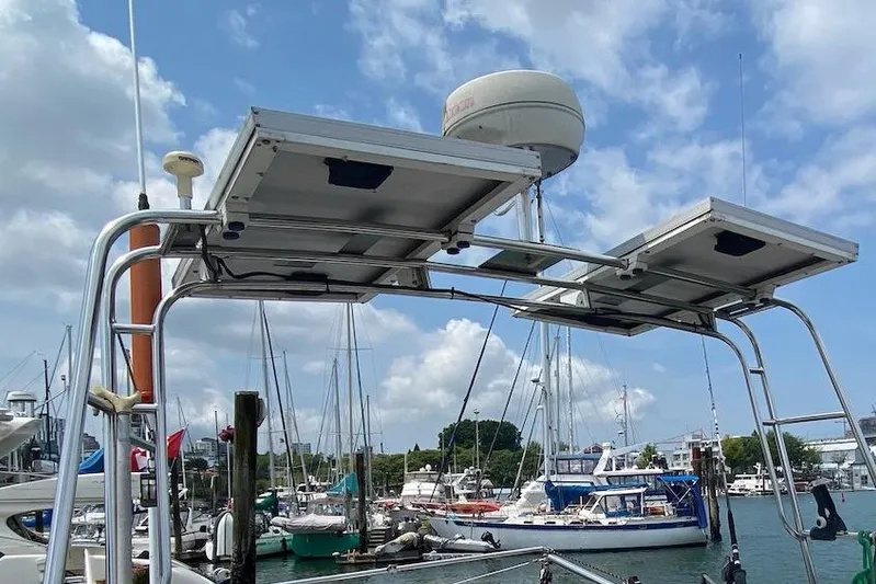 Ganache II Yacht Photos Pics Boat docked at marina with solar panels, Liberty 458, 1985 model.