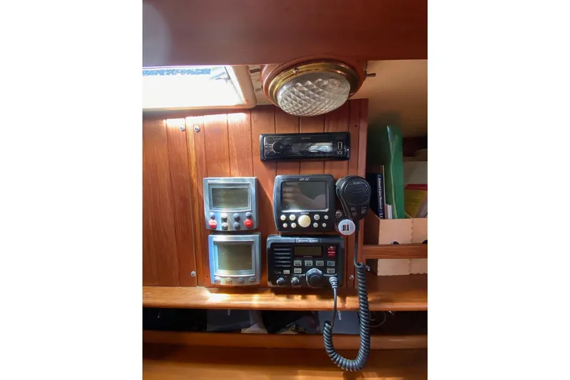 Ganache II Yacht Photos Pics 1985 Liberty 458 yacht control panel with navigation and communication equipment.