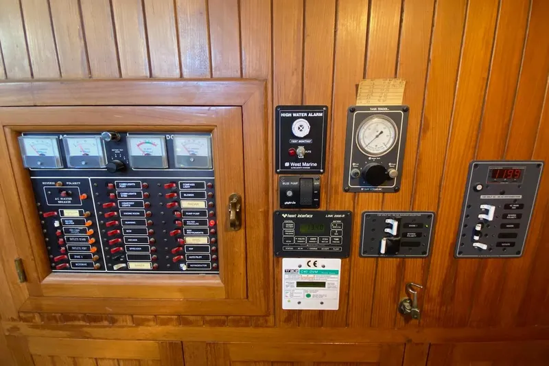 Ganache II Yacht Photos Pics Electrical control panel on a 1985 Liberty 458 boat with gauges and switches.