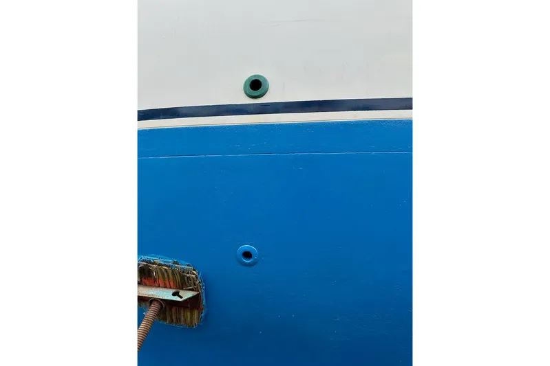 Ganache II Yacht Photos Pics Close-up of a blue and white Liberty 458 boat hull, 1985 model.