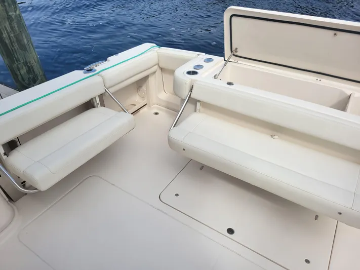  Yacht Photos Pics 2022 Grady-White Express 370 boat interior with cushioned seating and storage compartments.