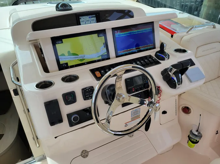  Yacht Photos Pics 2022 Grady-White Express 370 helm with dual navigation screens and controls.