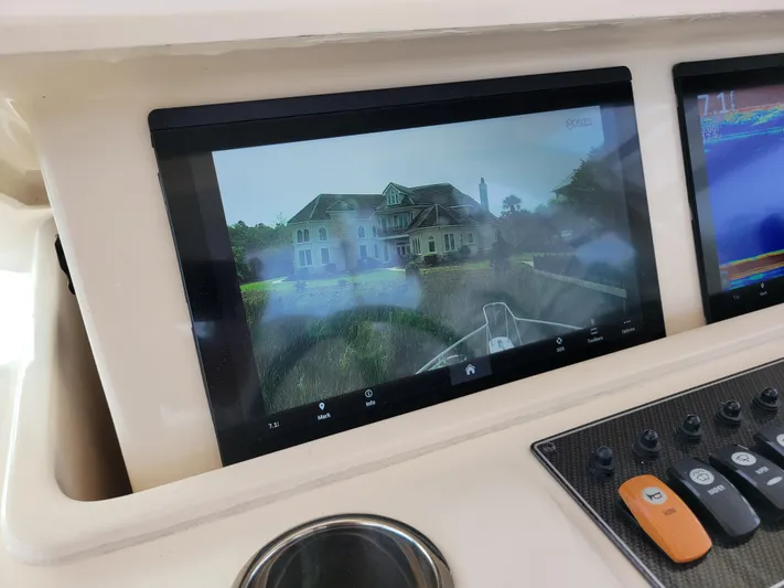 Yacht Photos Pics Dashboard of 2022 Grady-White Express 370 with navigation screen displaying a house.