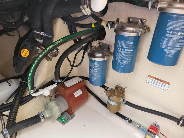  Yacht Photos Pics Engine compartment of 2022 Grady-White Express 370 with filters and hoses.