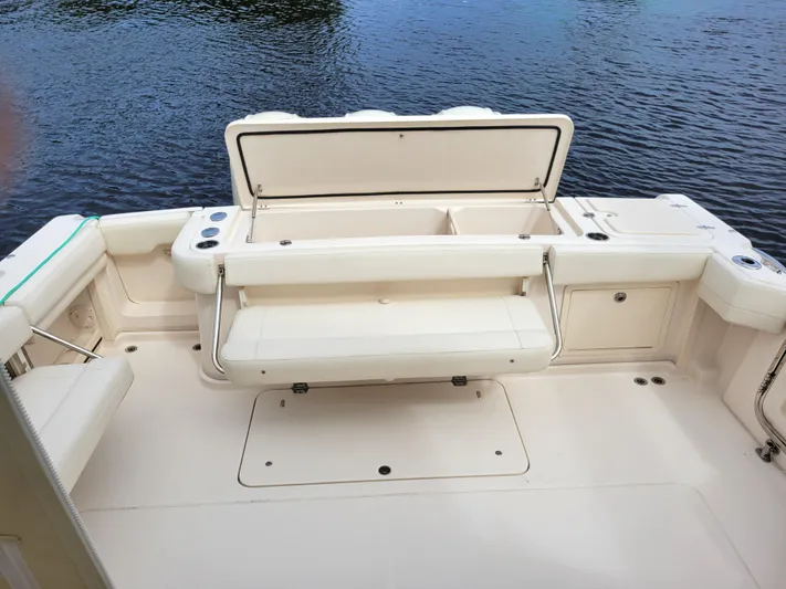  Yacht Photos Pics 2022 Grady-White Express 370 boat deck with open storage, near water.