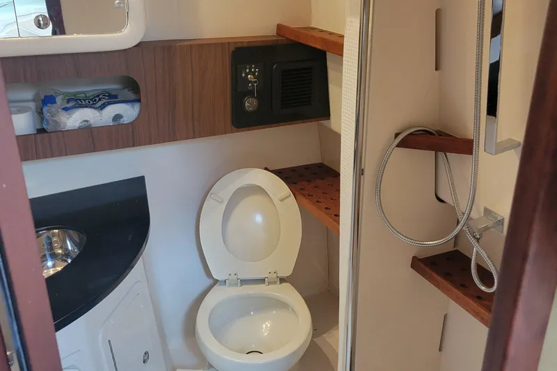  Yacht Photos Pics 2022 Grady-White Express 370 boat bathroom with toilet, sink, and shower.