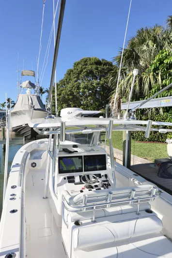  Yacht Photos Pics 2022 Contender 39 ST boat docked, featuring sleek design and advanced navigation systems.