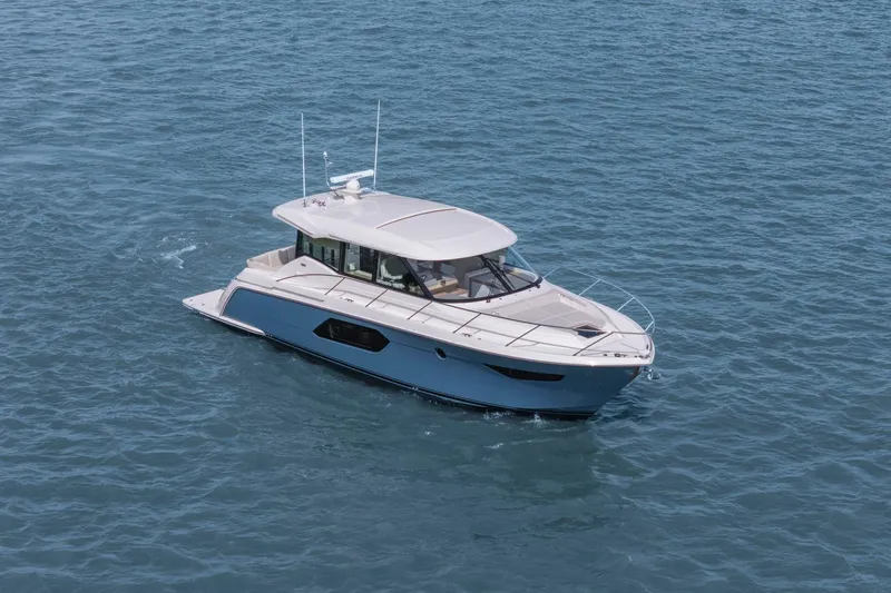 Seeker Yacht Photos Pics 2023 Tiara Yachts C49 Coupe cruising on open water.