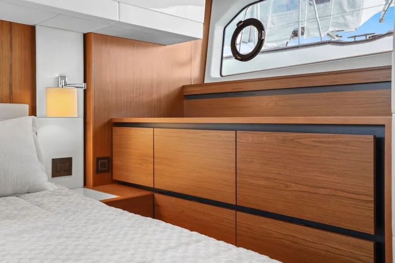 Seeker Yacht Photos Pics Luxurious interior of 2023 Tiara Yachts C49 Coupe with elegant wood finish and modern design.