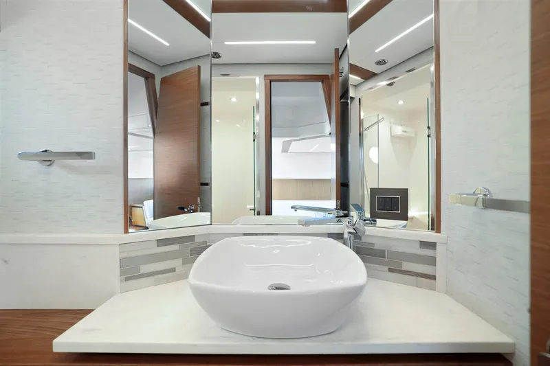 Seeker Yacht Photos Pics Luxurious bathroom in 2023 Tiara Yachts C49 Coupe with modern sink and elegant design.