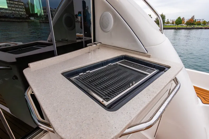  Yacht Photos Pics Outdoor grill on 2008 Sea Ray 60 Sundancer yacht, docked by waterfront.