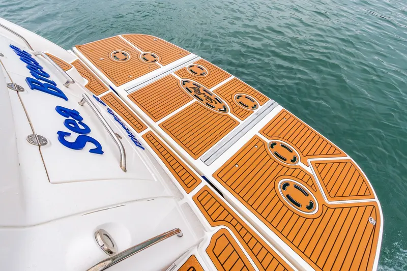  Yacht Photos Pics 2008 Sea Ray 60 Sundancer swim platform with teak decking on calm water.