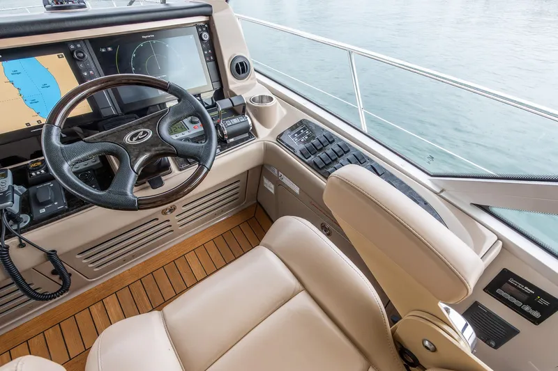  Yacht Photos Pics Helm of 2008 Sea Ray 60 Sundancer with navigation screens and leather seating.