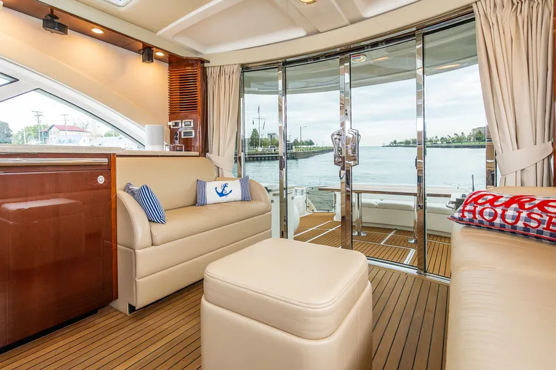  Yacht Photos Pics Luxurious interior of 2008 Sea Ray 60 Sundancer yacht with elegant seating and waterfront view.
