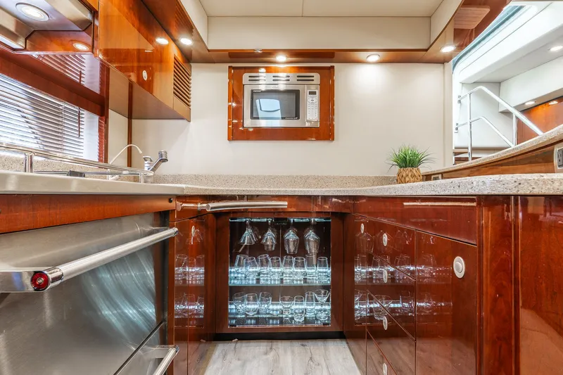  Yacht Photos Pics Luxurious 2008 Sea Ray 60 Sundancer yacht kitchen with modern appliances and elegant wood cabinetry.