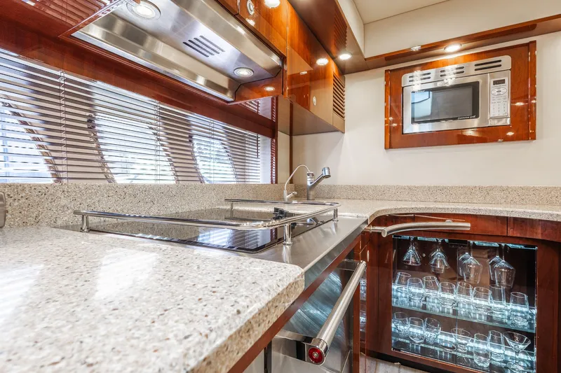  Yacht Photos Pics Luxurious kitchen interior of 2008 Sea Ray 60 Sundancer yacht with modern appliances.