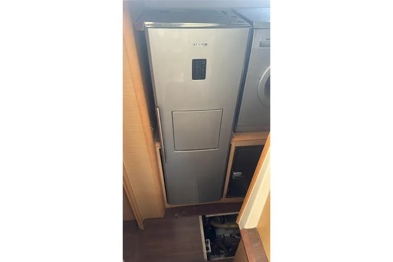  Yacht Photos Pics Modern kitchen appliances inside a 2010 Lagoon 500 yacht, featuring a sleek refrigerator.