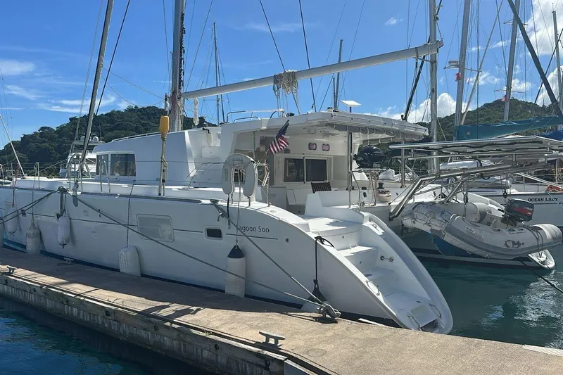 Yacht Photos Pics 2010 Lagoon 500 catamaran docked at marina under clear blue sky.