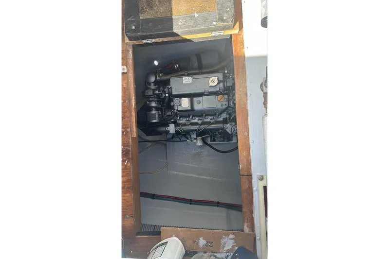  Yacht Photos Pics Engine compartment of a 2010 Lagoon 500 catamaran, showcasing mechanical components.