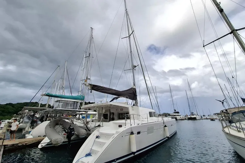  Yacht Photos Pics 2010 Lagoon 500 catamaran docked at marina under cloudy sky.