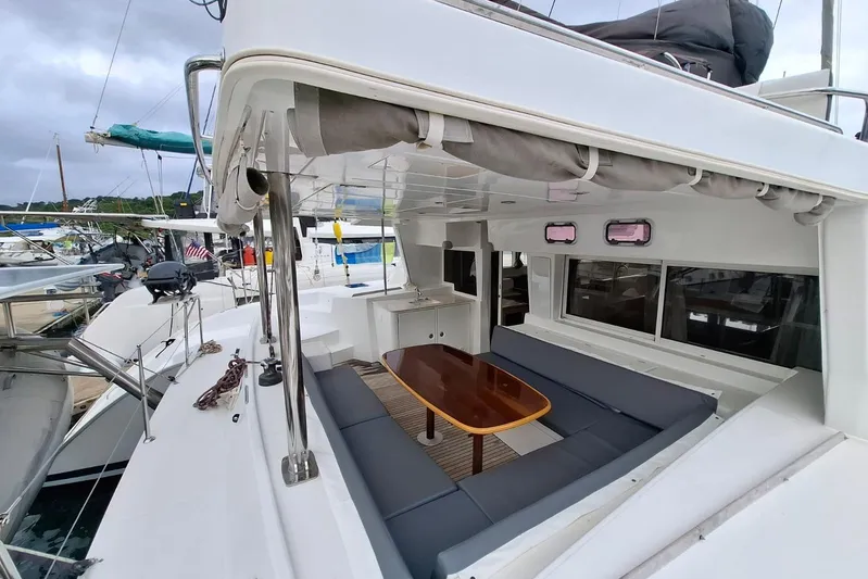  Yacht Photos Pics 2010 Lagoon 500 yacht with spacious outdoor seating and dining area at the marina.