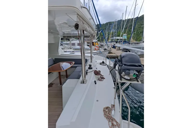  Yacht Photos Pics 2010 Lagoon 500 yacht docked, featuring spacious deck and seating area.