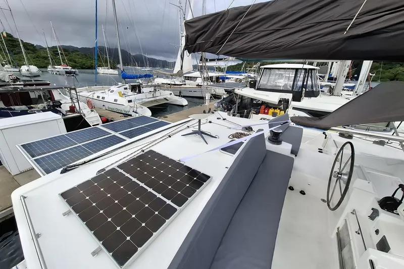  Yacht Photos Pics 2010 Lagoon 500 catamaran with solar panels docked in a marina.