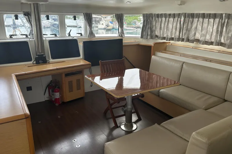  Yacht Photos Pics Interior of 2010 Lagoon 500 yacht with seating, table, and navigation equipment.