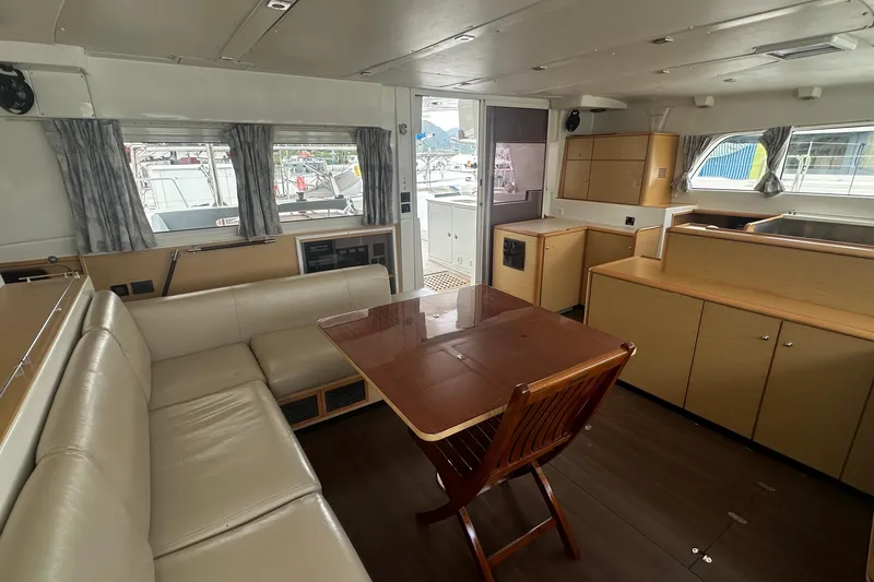  Yacht Photos Pics Spacious interior of 2010 Lagoon 500 yacht with seating and dining area.