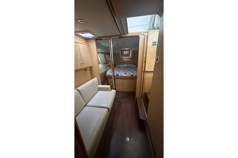  Yacht Photos Pics Interior of 2010 Lagoon 500 yacht with cozy seating and bedroom area.