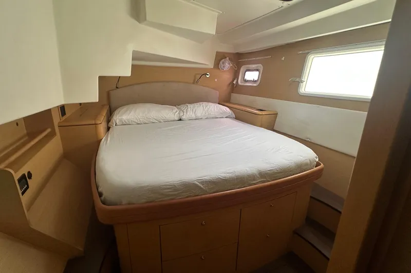  Yacht Photos Pics Cozy bedroom in 2010 Lagoon 500 yacht with a comfortable bed and natural light.