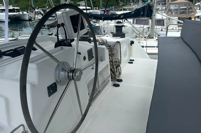 Yacht Photos Pics Steering wheel and cockpit of a 2010 Lagoon 500 yacht in a marina.