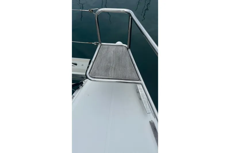  Yacht Photos Pics Bow of 2010 Lagoon 500 catamaran with stainless steel railing and wooden platform.