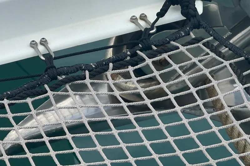  Yacht Photos Pics Close-up of Lagoon 500 catamaran's anchor and netting, 2010 model.