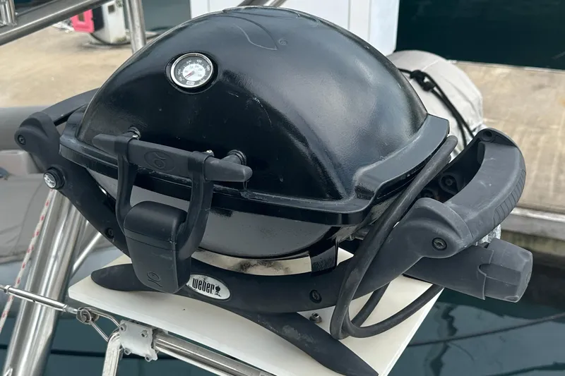  Yacht Photos Pics Portable black grill on a Lagoon 500 yacht, 2010 model, docked at a marina.