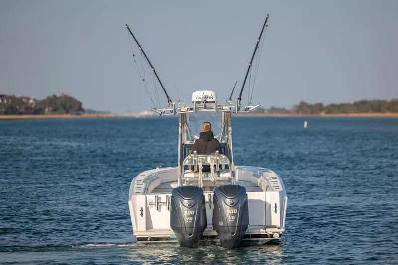  Yacht Photos Pics 2013 Contender 32 Tournament boat with dual engines on open water.