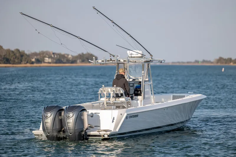  Yacht Photos Pics 2013 Contender 32 Tournament boat with dual Yamaha engines on open water.