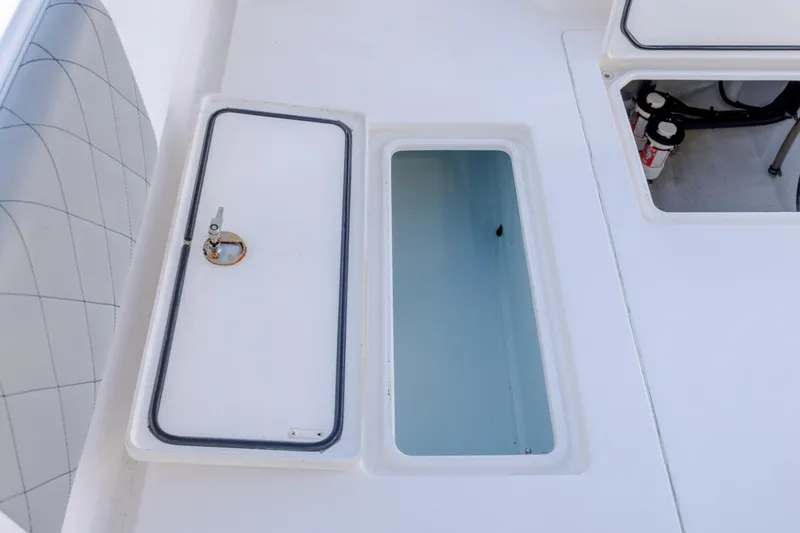  Yacht Photos Pics 2013 Contender 32 Tournament boat storage compartments and seating detail.
