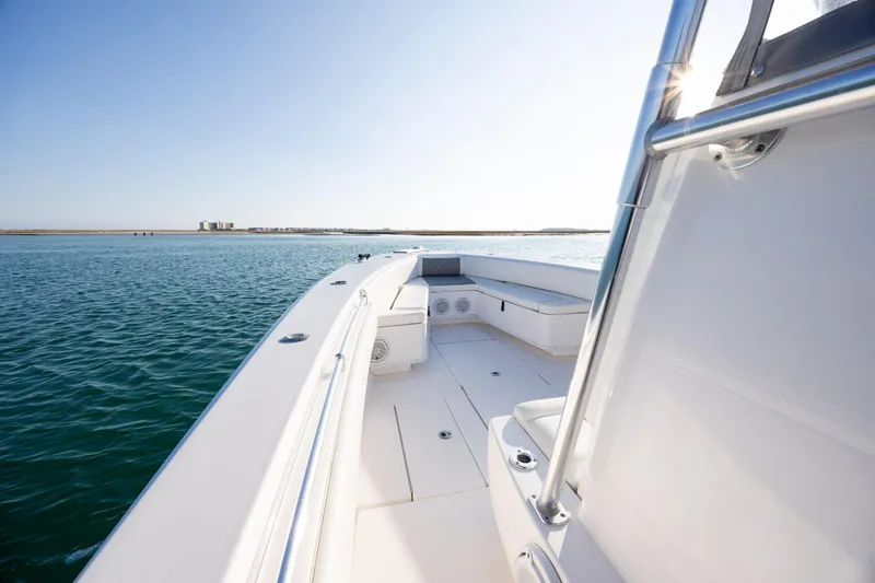  Yacht Photos Pics 2013 Contender 32 Tournament boat on calm water, showcasing sleek deck design.