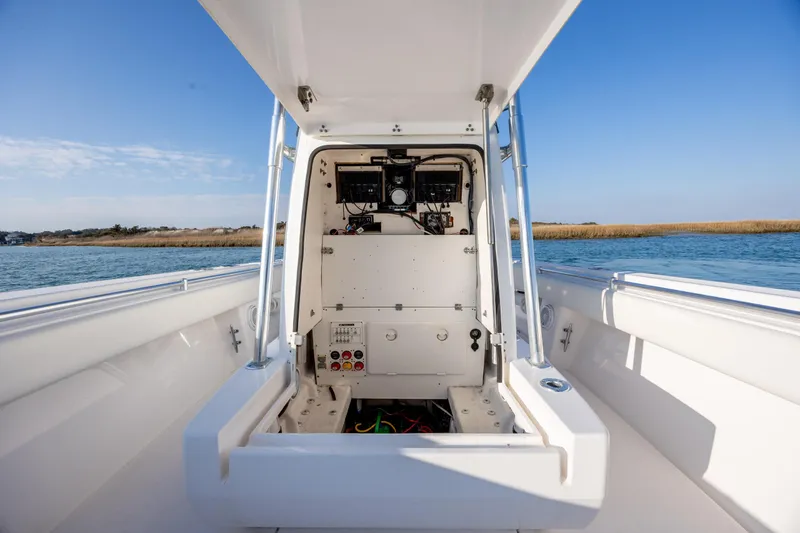  Yacht Photos Pics 2013 Contender 32 Tournament boat interior with open console, on calm water.