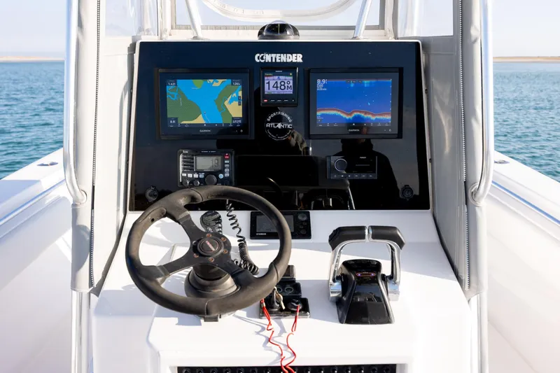  Yacht Photos Pics 2013 Contender 32 Tournament boat dashboard with navigation and control systems.