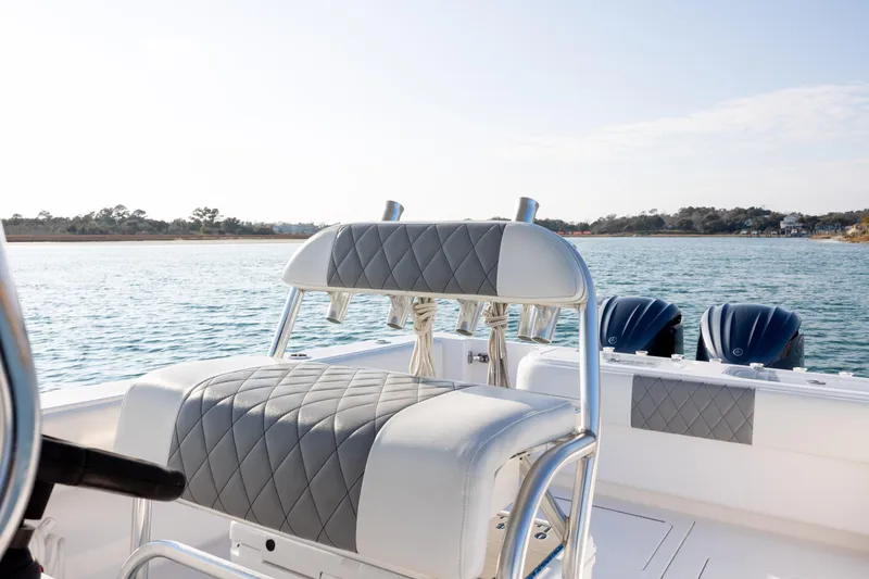  Yacht Photos Pics 2013 Contender 32 Tournament boat with cushioned seating, dual engines, and scenic water view.