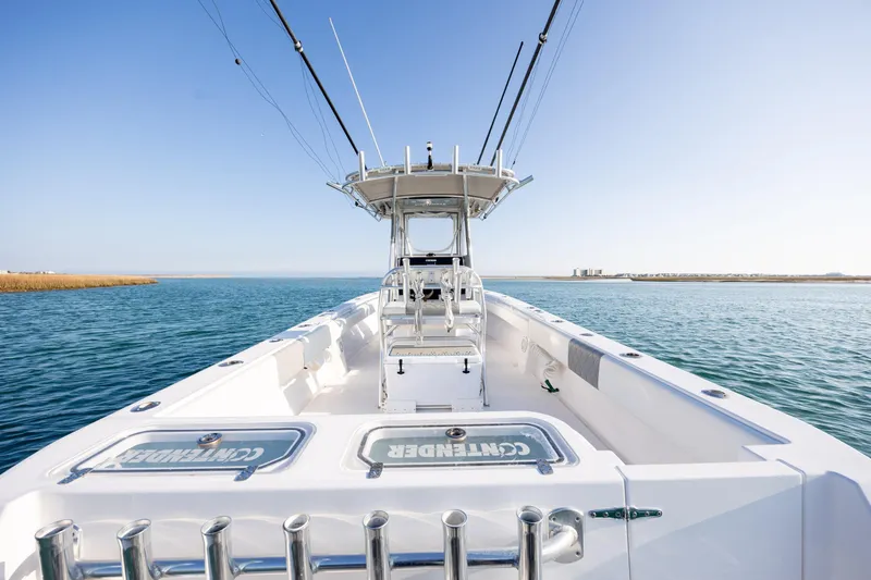  Yacht Photos Pics 2013 Contender 32 Tournament boat on open water, clear sky, fishing rods visible.