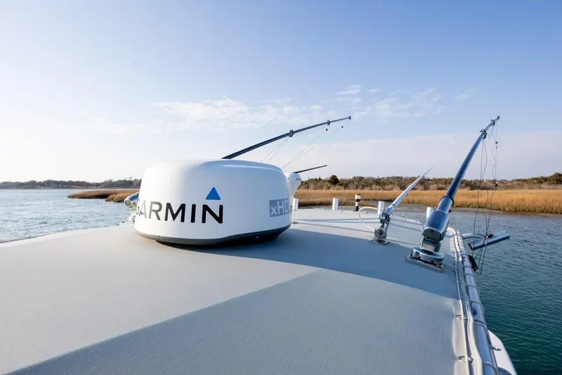  Yacht Photos Pics 2013 Contender 32 Tournament boat with Garmin radar on calm water.