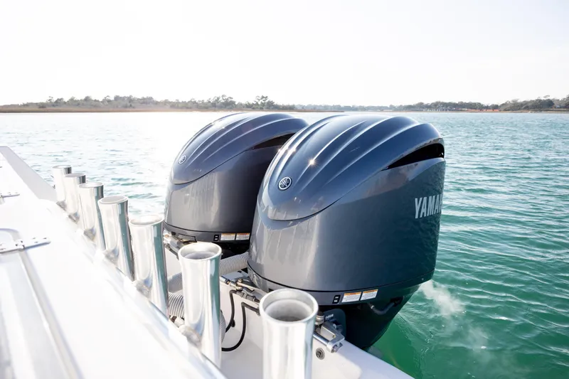 Yacht Photos Pics Twin Yamaha outboard engines on a 2013 Contender 32 Tournament boat in open water.