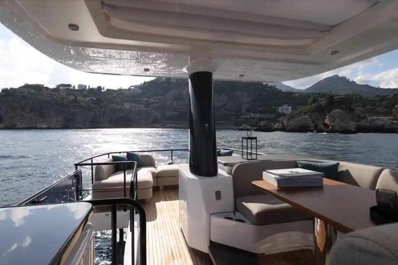  Yacht Photos Pics Luxurious 2025 Azimut 60 Magellano yacht deck with scenic coastal view.