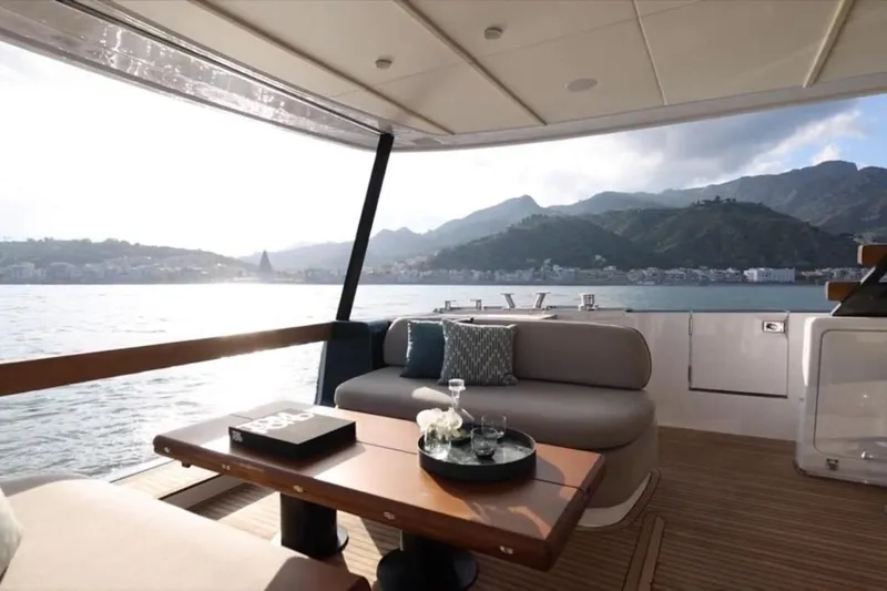  Yacht Photos Pics Luxurious 2025 Azimut 60 Magellano yacht interior with scenic ocean and mountain views.